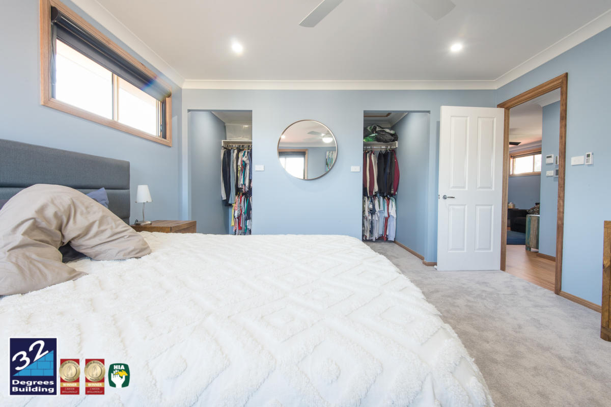 His and hers walk in robes in the master bedroom of second storey addition